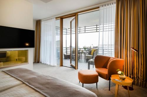 TV o dispositivi per l'intrattenimento presso BUDERSAND Hotel - Golf & Spa - Sylt