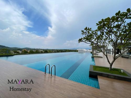 a swimming pool on the roof of a building at MAYARA Homestay @ Residensi Lili in Nilai