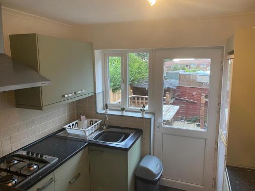 a kitchen with a sink and a window at Montrose - Perfect Contractor Stay Own Driveway 3 bedrooms in Gateshead