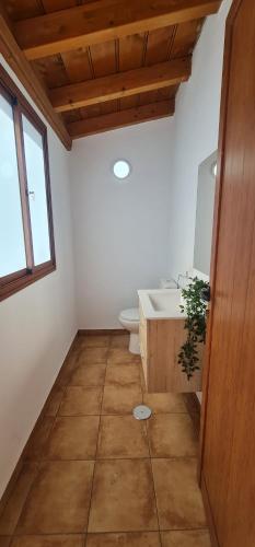 a bathroom with a tub and a toilet and a sink at Lina House Garden, BBQ & Outdoor Dining in Puntagorda