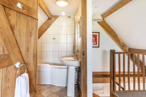 a bathroom with a sink and a toilet at Self-Catering at Craft Renaissance in Usk