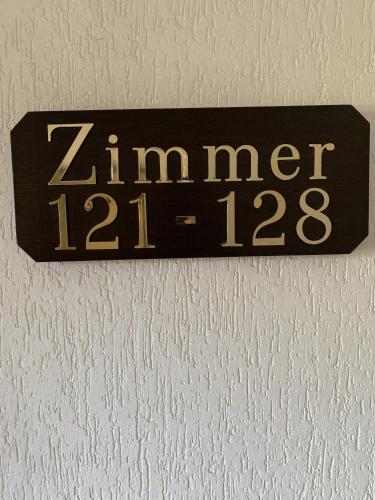 a sign on a wall that reads zimier at City Hotel Dinslaken in Dinslaken