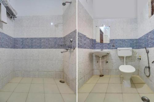 a bathroom with a toilet and a sink at Elegance Resort in Jait