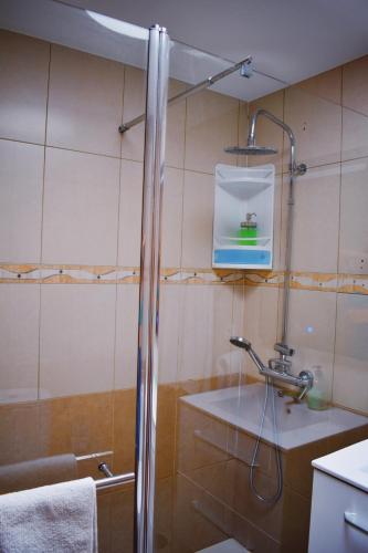 a bathroom with a shower and a sink at Bungalow Guayana in Mogán