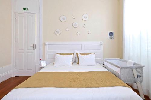 Ένα ή περισσότερα κρεβάτια σε δωμάτιο στο Casa Côrte Real