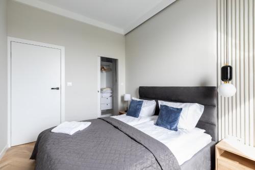 Posteľ alebo postele v izbe v ubytovaní P&O Apartments Rydygiera II