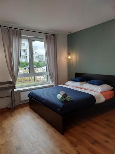 Postel nebo postele na pokoji v ubytování M2 Bemowo apartament