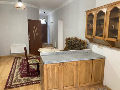 a kitchen with a counter and a chair in a room at Gyumri house in Gyumri