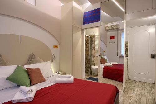 A bed or beds in a room at La Chicca Pontevecchio