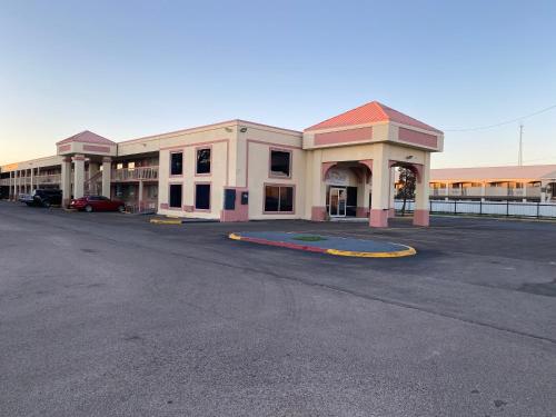 an empty parking lot in front of a building at Baymont Inn by Wyndham Odessa University Area in Odessa