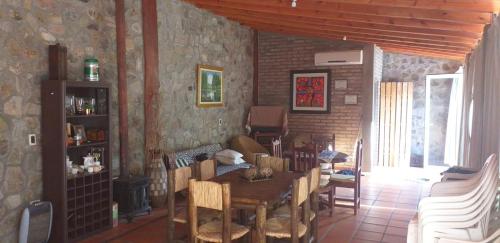a dining room with a table and chairs at Mamá Quilla in La Rioja