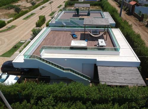 an overhead view of a building with a roof at Ocean Club Resort Beach House in Juan de Acosta