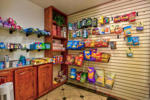 a room with a wall filled with toys and gifts at Ramada by Wyndham Oklahoma City Airport North in Oklahoma City