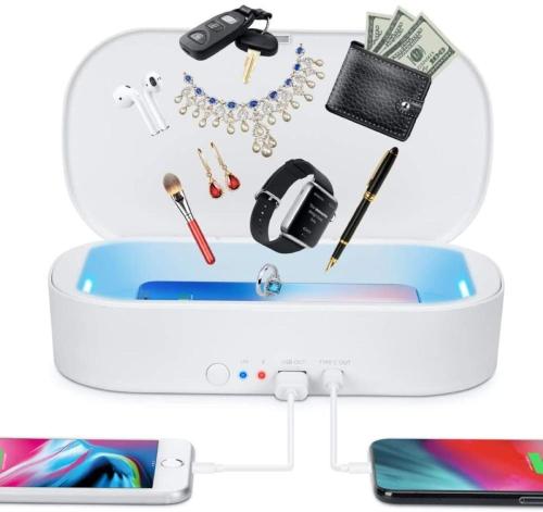 an open suitcase with a cell phone and accessories at Heavenly Hana Paradise in Hana