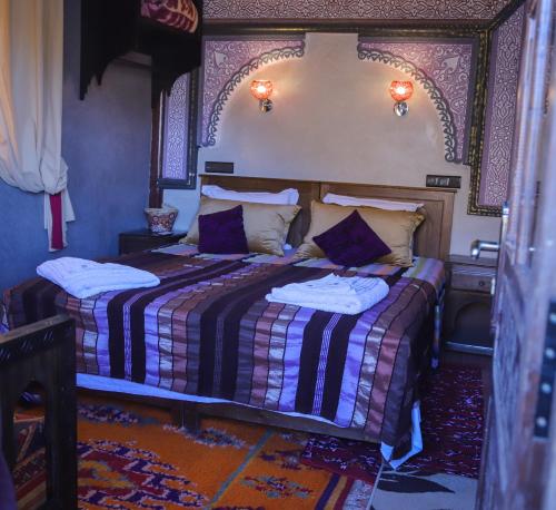 Ein Bett oder Betten in einem Zimmer der Unterkunft Riad Atlas Panorama