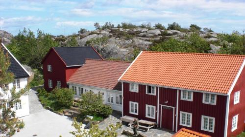 a group of red houses with orange roofs at Skottevik Feriesenter in Skottevik