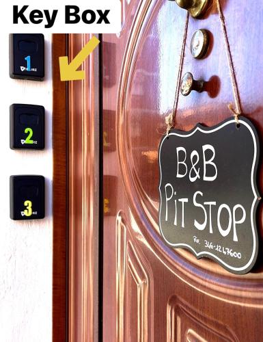 a sign on a door that says beb pit stop at Pit stop Ciampino Station in Ciampino