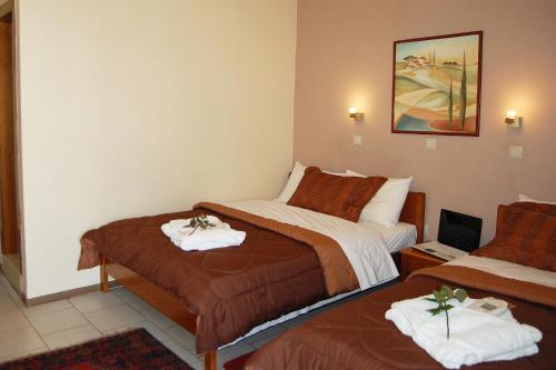 Postel nebo postele na pokoji v ubytování Paris Hotel
