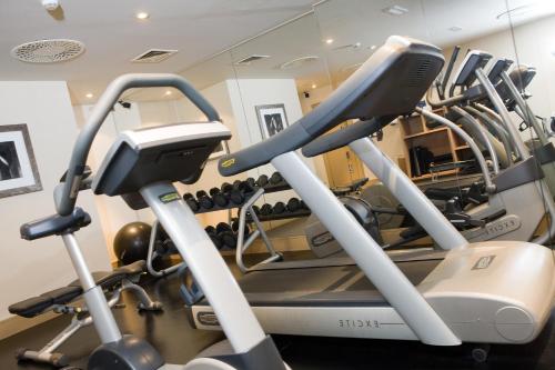a gym with two treadmill machines and a mirror at Malmaison Aberdeen in Aberdeen