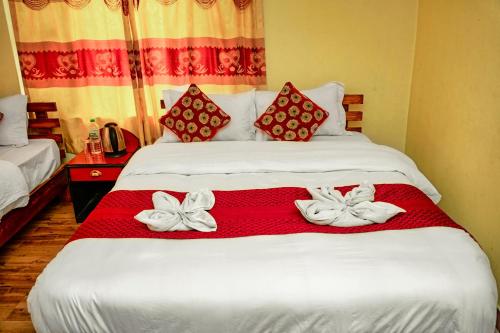 Hotel Plaza Nepalにあるベッド