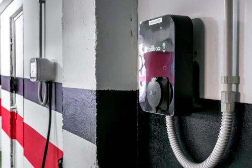 a pay phone on the side of a wall at Hotel Sansi Park in Lleida