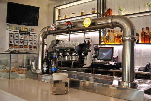 a bar with a faucet over a counter at Hotel Reigosa in Pontevedra