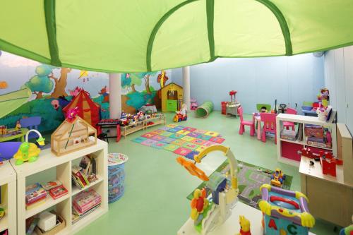 a play room with many different toys in it at Hotel Europa Lignano in Lignano Sabbiadoro