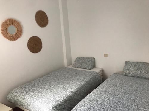 A bed or beds in a room at Canteras Home