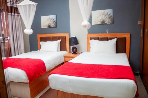 Postel nebo postele na pokoji v ubytování Top Lodge in Blantyre