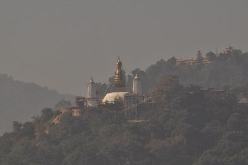 a group of buildings on top of a hill at Tibet Guest House in Kathmandu