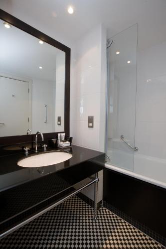 a bathroom with a sink and a shower at Malmaison Edinburgh in Edinburgh