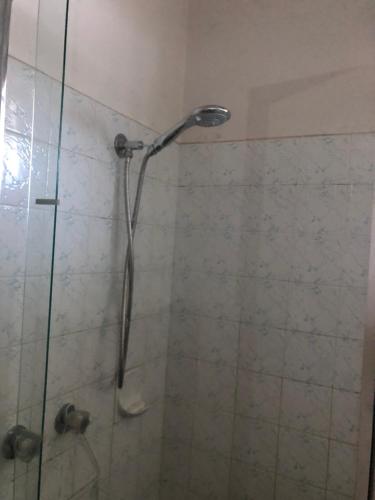 a shower with a shower head in a bathroom at Golden House in Springvale