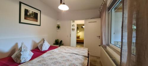 a bedroom with a bed and a window at Auf dem Reiterhof in Wernigerode