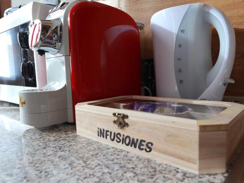 a kitchen counter with a sewing machine and a wooden box at Relax&Natura a 6 minuti da BRESCIA Wifi a Rezzato in Rezzato
