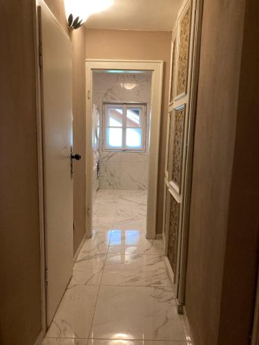 a hallway with a tile floor in a house at (C) Zimmer in einem Bauernhaus in Anif