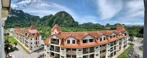 an aerial view of a building with mountains in the background at Doma House Alpine at Lost World of Tambun in Tambun