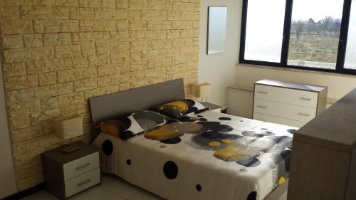 a bedroom with a large bed with pillows on it at Panorama Lucano in Altamura