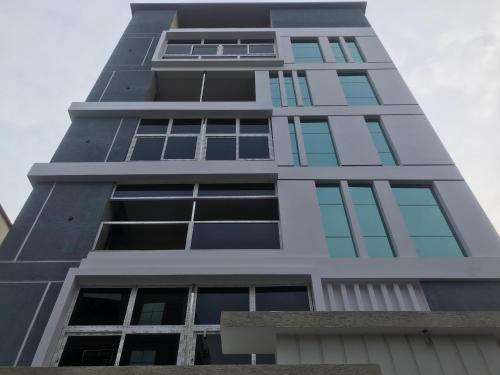 a tall building with many windows at Ramya Grand in Visakhapatnam