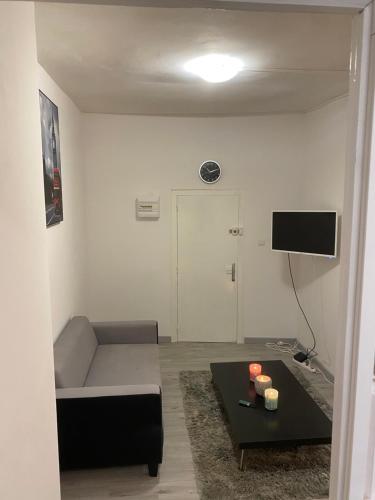 TV a/nebo společenská místnost v ubytování AU COEUR DU CENTRE