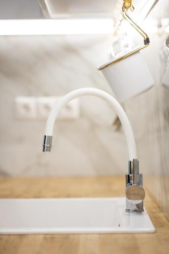 a kitchen sink with a faucet at A casa nostra in Loutraki
