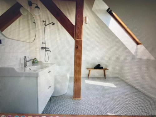 a bathroom with a sink and a bath tub at Marymont Metro Apartment in Warsaw
