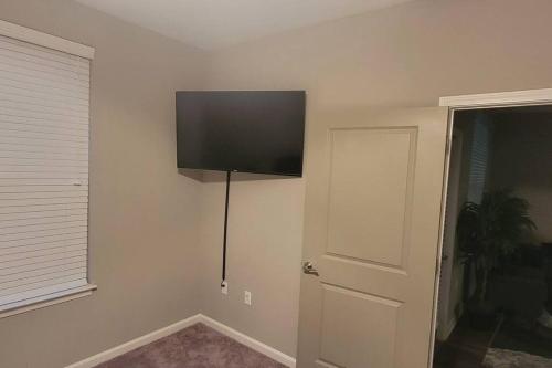 A television and/or entertainment centre at Luxury 2 Bedroom 2 Bath and 1 Car Garage with Pool