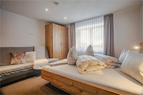 Postel nebo postele na pokoji v ubytování Apartments Renata Gries 201