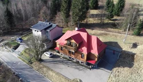 an aerial view of a house with a red roof at Leonardo Guesthouse in Świeradów-Zdrój