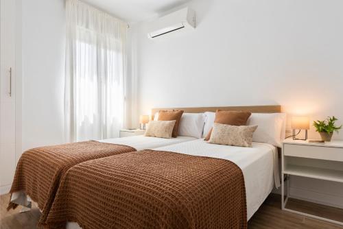 A bed or beds in a room at Avanti Luz de Sevilla, hazte un regalo y disfrutalo