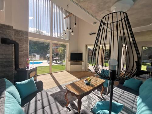 a living room with a couch and a table at Villa EMIR in Sarajevo