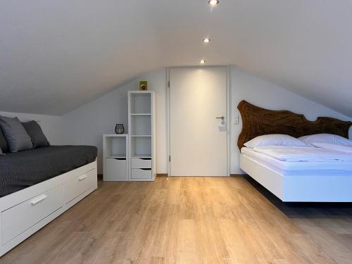 a large bedroom with a bed and a closet at *Wohnung SCHWARZWALD*Unikat in VS mit Terrasse in Villingen-Schwenningen