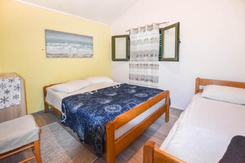a room with two beds in a room at House Vagabond in Tkon