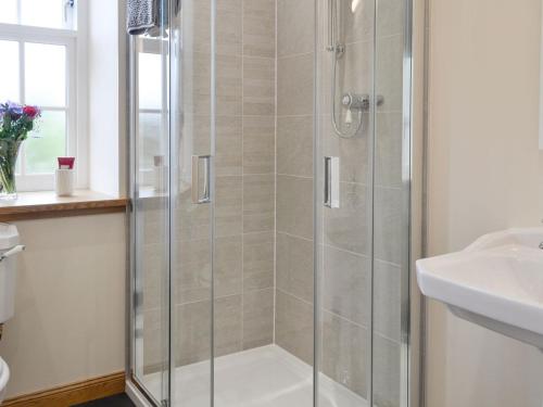 a bathroom with a shower and a sink at The Stables - Uk11108 in Montrose