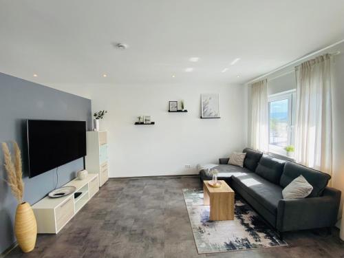 TV a/nebo společenská místnost v ubytování Gemütliche Neubauwohnung 70qm